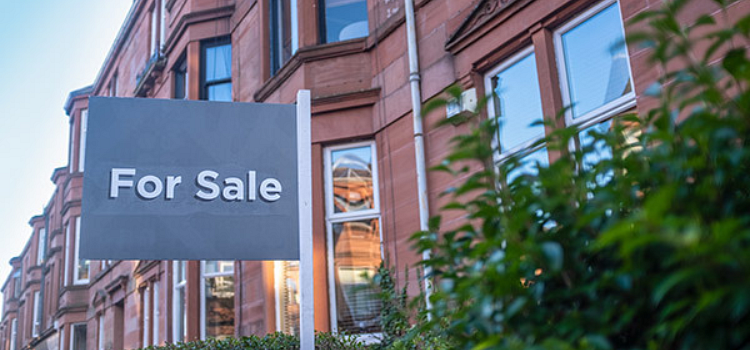 For sale sign outside flats